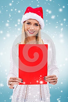 Â  Beautiful woman with santa hat, holding a red paper without subtitles